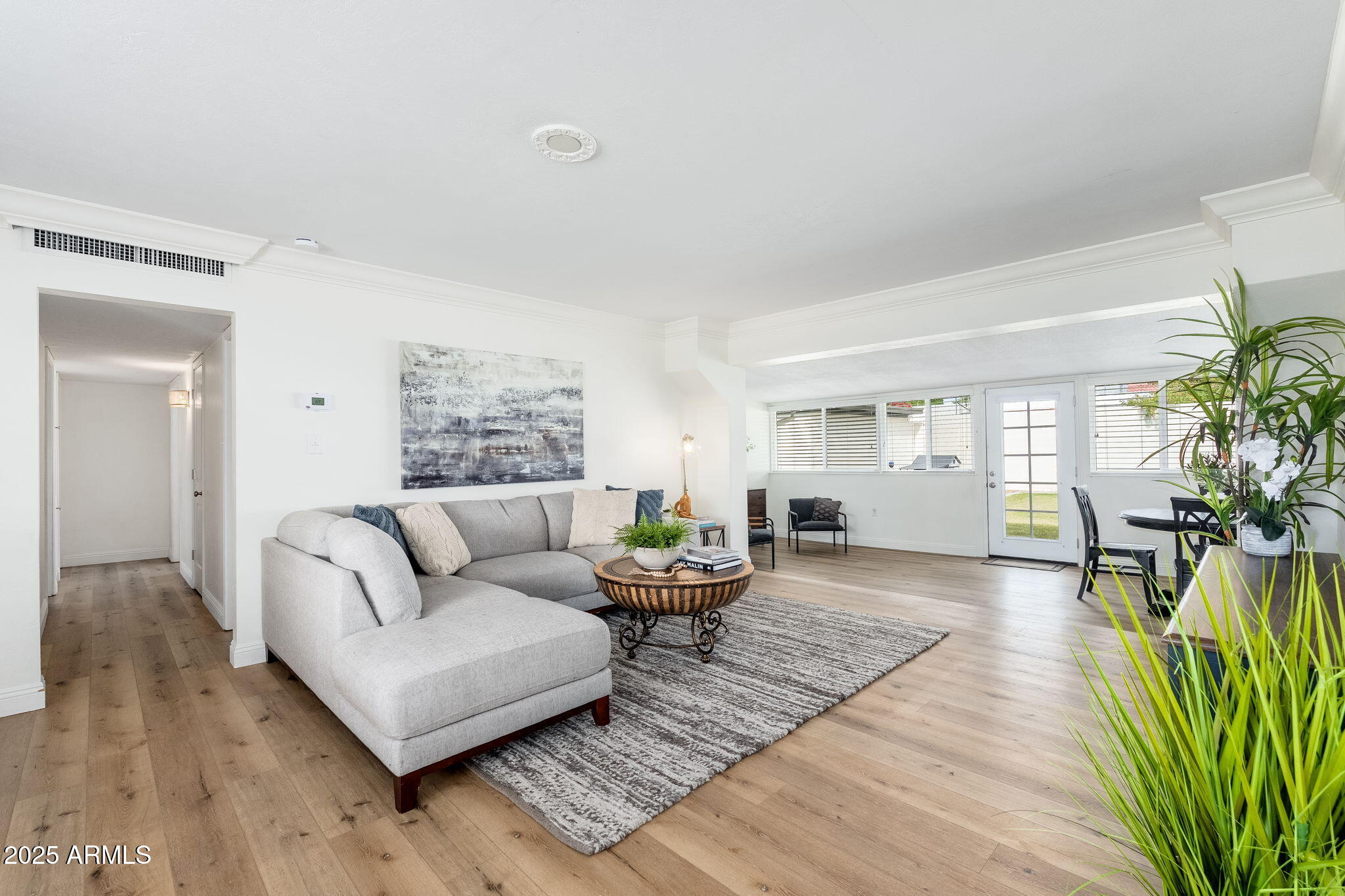 3002 East Whitton Avenue Phoenix, AZ 85016 - Photo 3 of 32 a living room with furniture and a wooden floor