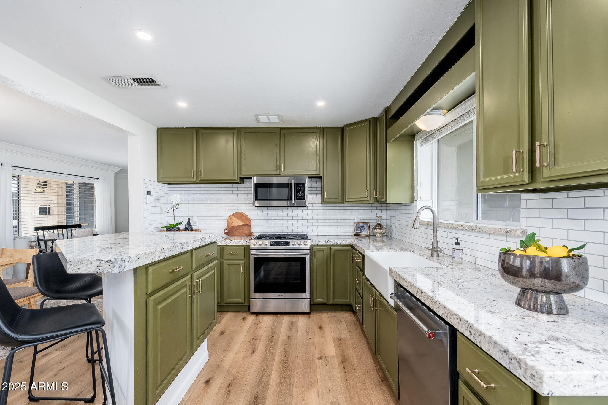 3002 East Whitton Avenue Phoenix, AZ 85016 - Photo 5 of 32 a kitchen with a sink cabinets and wooden floor