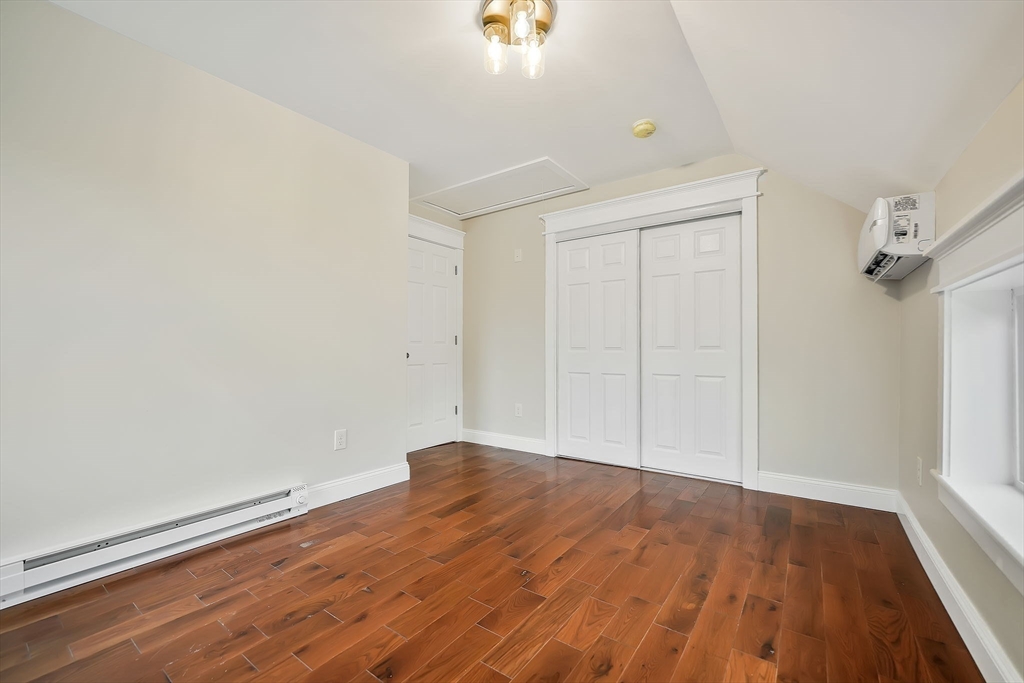 16 Water Street, Unit D Freetown, MA 02702 - Photo 14 of 23 an empty room with wooden floor and windows