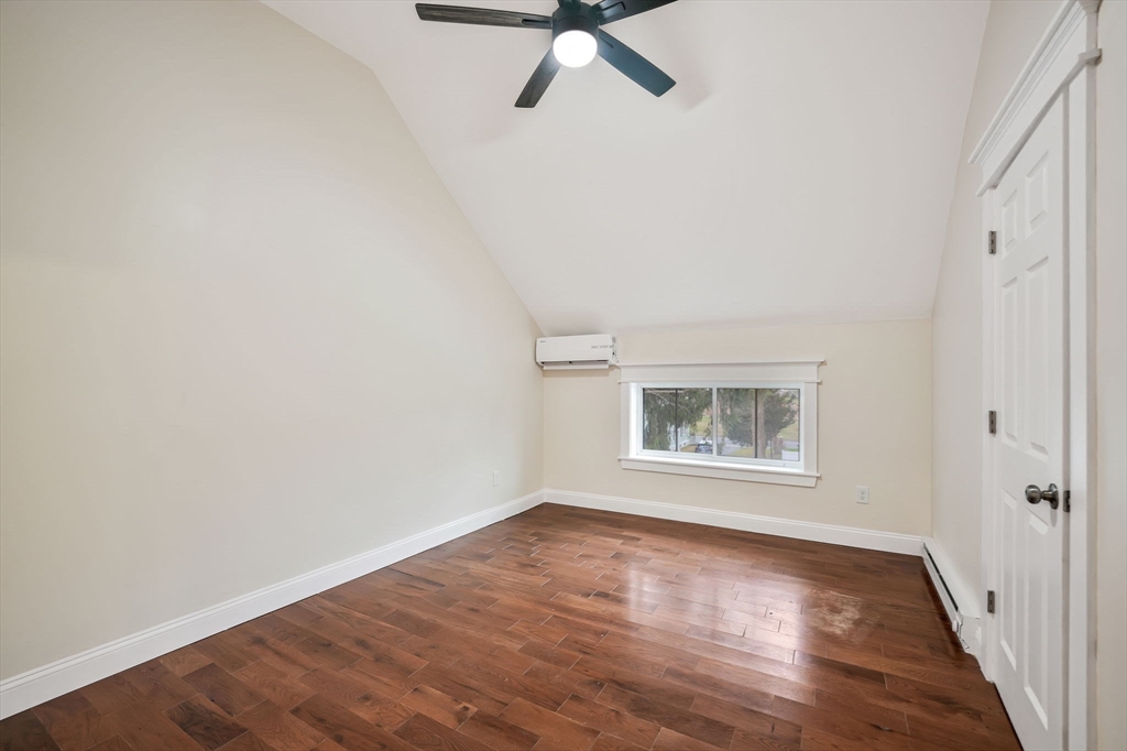 16 Water Street, Unit D Freetown, MA 02702 - Photo 16 of 23 an empty room with wooden floor fan and windows