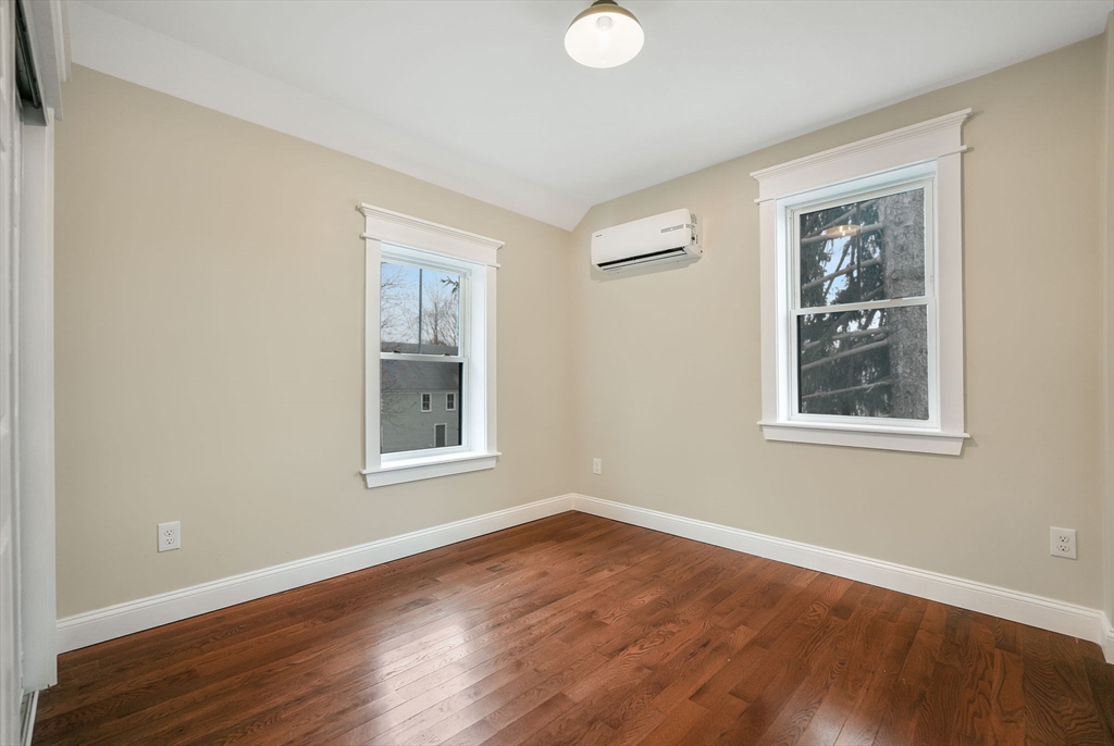 16 Water Street, Unit D Freetown, MA 02702 - Photo 17 of 24 a view of an empty room with wooden floor and a window