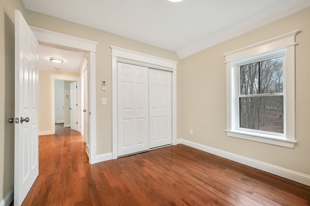 16 Water Street, Unit D Freetown, MA 02702 - Photo 18 of 24 wooden floor in an empty room with a window