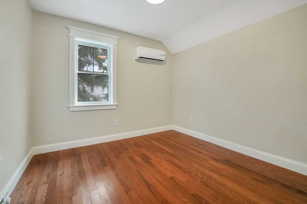 16 Water Street, Unit D Freetown, MA 02702 - Photo 21 of 24 a view of an empty room with wooden floor and a window