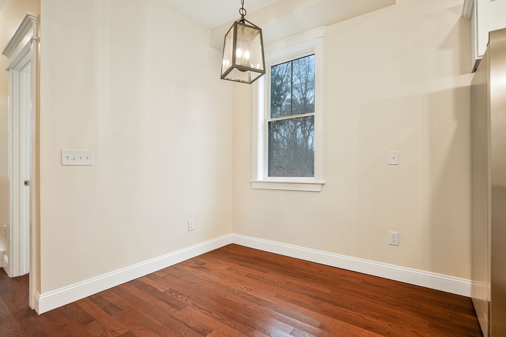 16 Water Street, Unit D Freetown, MA 02702 - Photo 5 of 24 a view of a room with wooden floor cabinet and windows