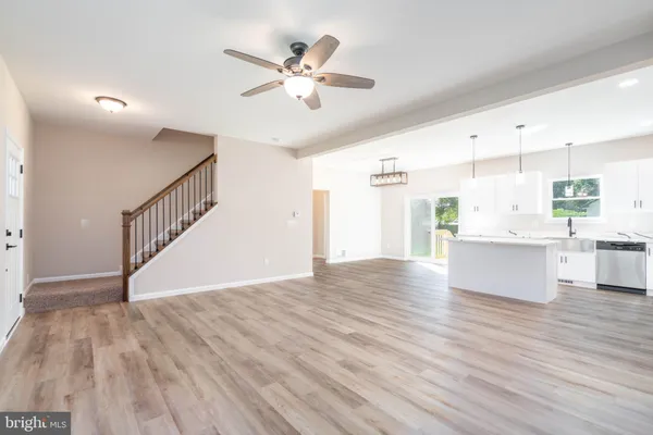 a view of kitchen with cabinets and wooden floor