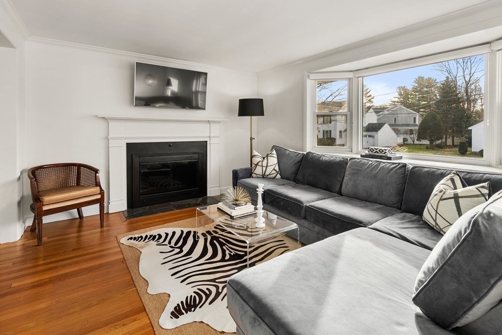 35 Fells Road Wellesley, MA 02482 - Photo 3 of 13 a living room with furniture a fireplace and a flat screen tv