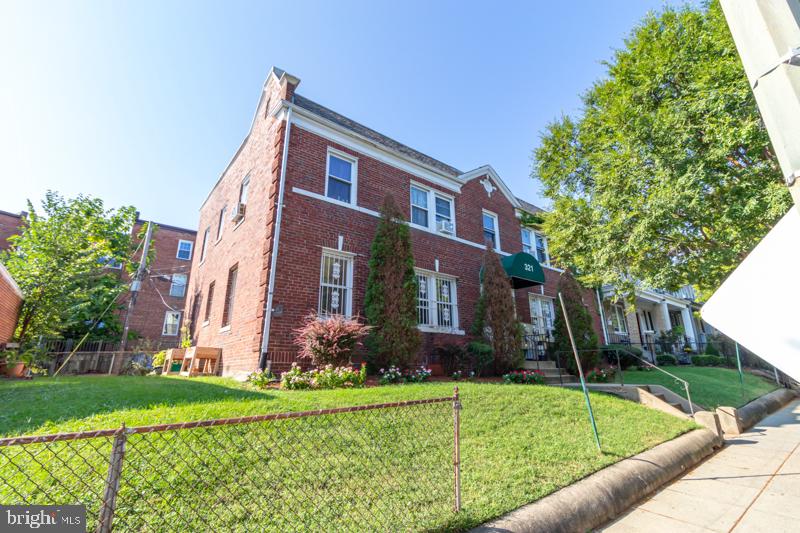 321 Adams Street Northeast Washington, DC 20002 - Photo 2 of 5 Charming brick duplex with lush greenery.