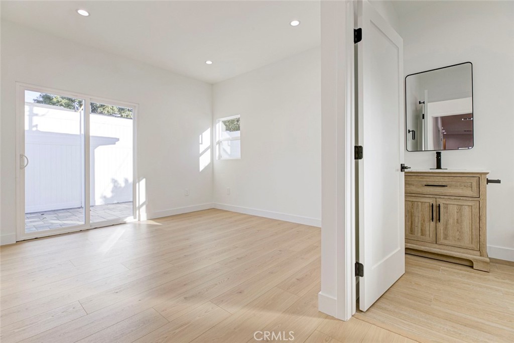 2240 North Keystone Street Burbank, CA 91504 - Photo 16 of 24 a view of empty room with wooden floor and window