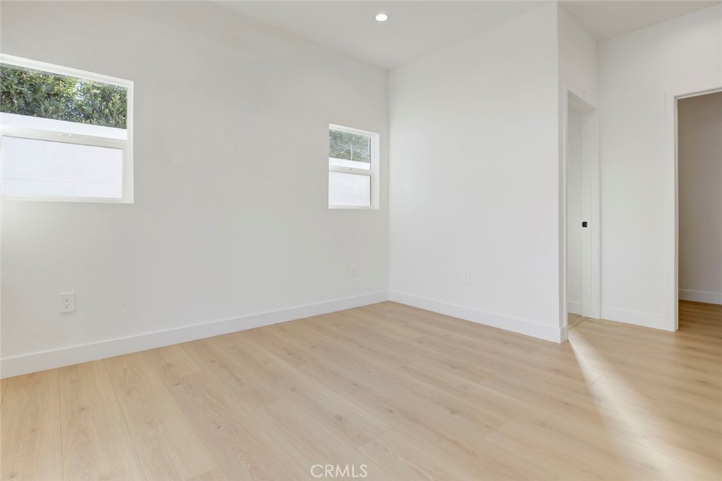 2240 North Keystone Street Burbank, CA 91504 - Photo 18 of 24 an empty room with wooden floor and windows