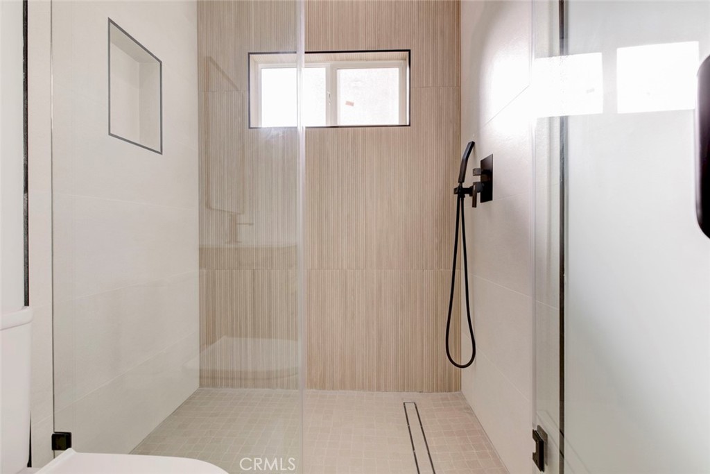 2240 North Keystone Street Burbank, CA 91504 - Photo 21 of 24 a bathroom with a glass shower door