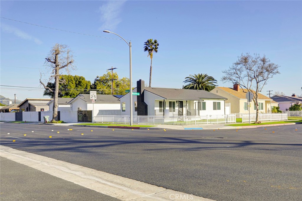 2240 North Keystone Street Burbank, CA 91504 - Photo 24 of 24 a front view of a house with a yard and trees