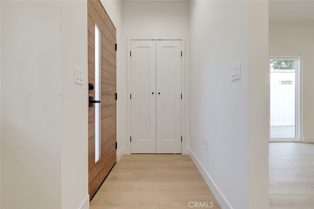 2240 North Keystone Street Burbank, CA 91504 - Photo 4 of 24 a view of a hallway with wooden floor