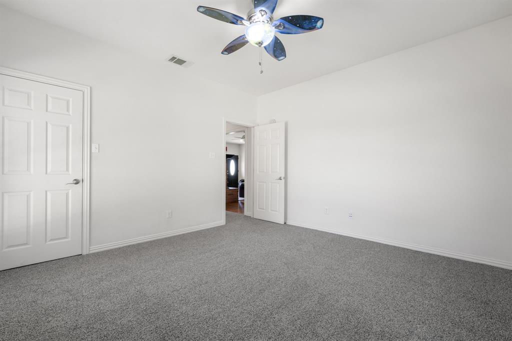 510 South Swanson Road Mineral Wells, TX 76067 - Photo 24 of 38 a view of an empty room and a ceiling fan