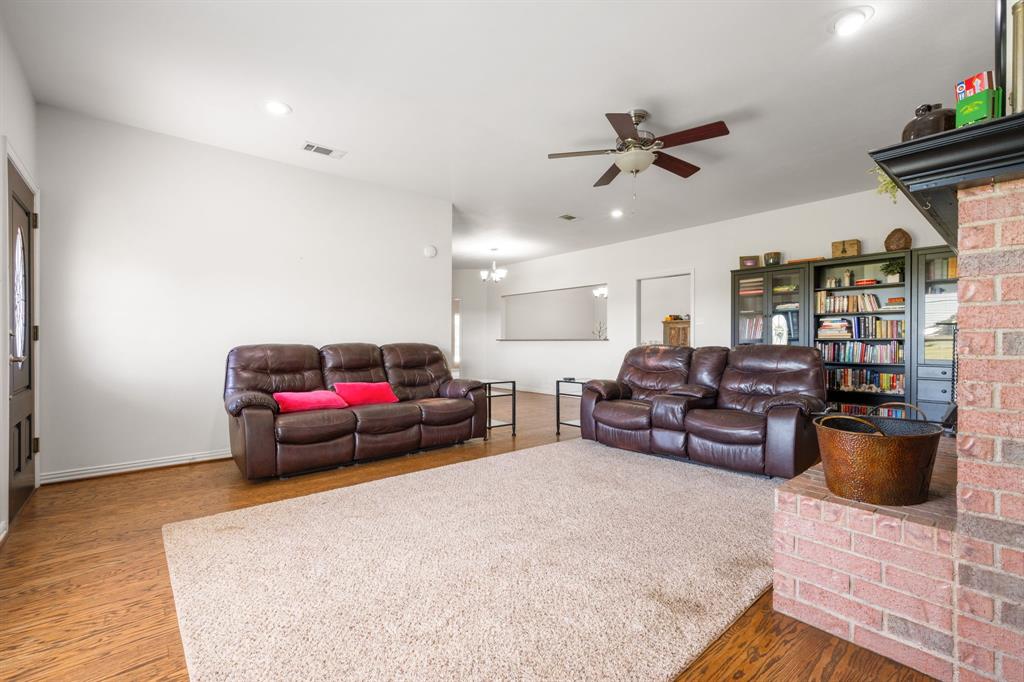 510 South Swanson Road Mineral Wells, TX 76067 - Photo 9 of 38 a living room with furniture and a wooden floor