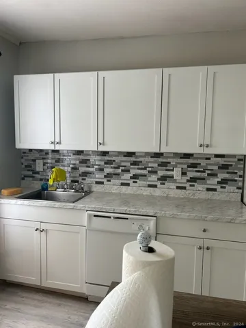 a bathroom with a sink and cabinets