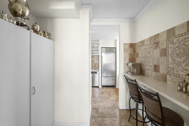 a kitchen with stainless steel appliances a sink stove and refrigerator