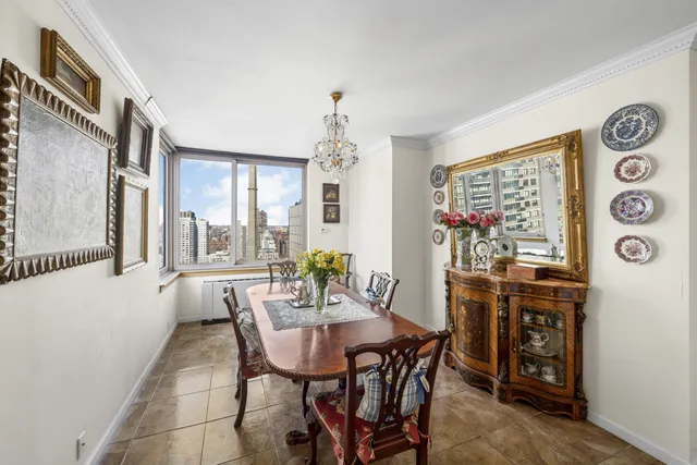 a view of a dining room with furniture and window