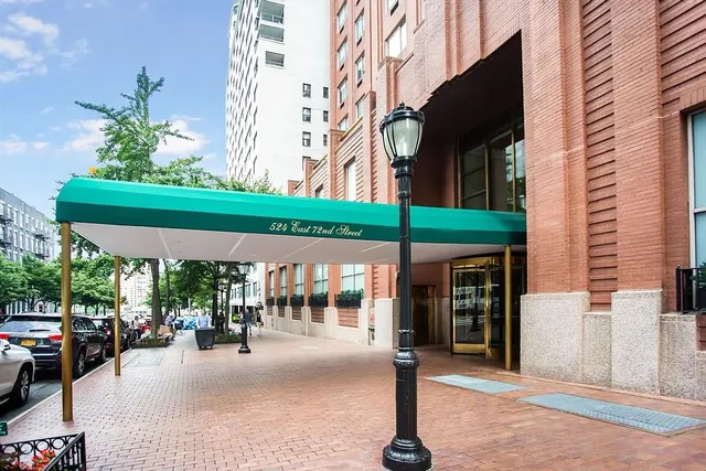 a view of a building with sitting area