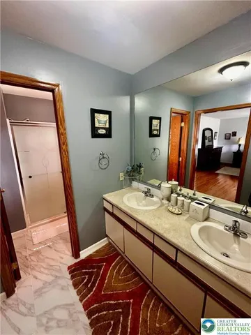 a bathroom with a sink a mirror and a toilet