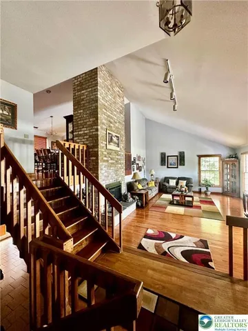 a view of a livingroom with furniture and white walls