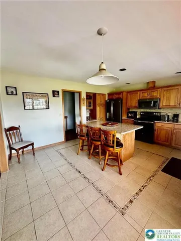 a view of a livingroom with furniture and a table