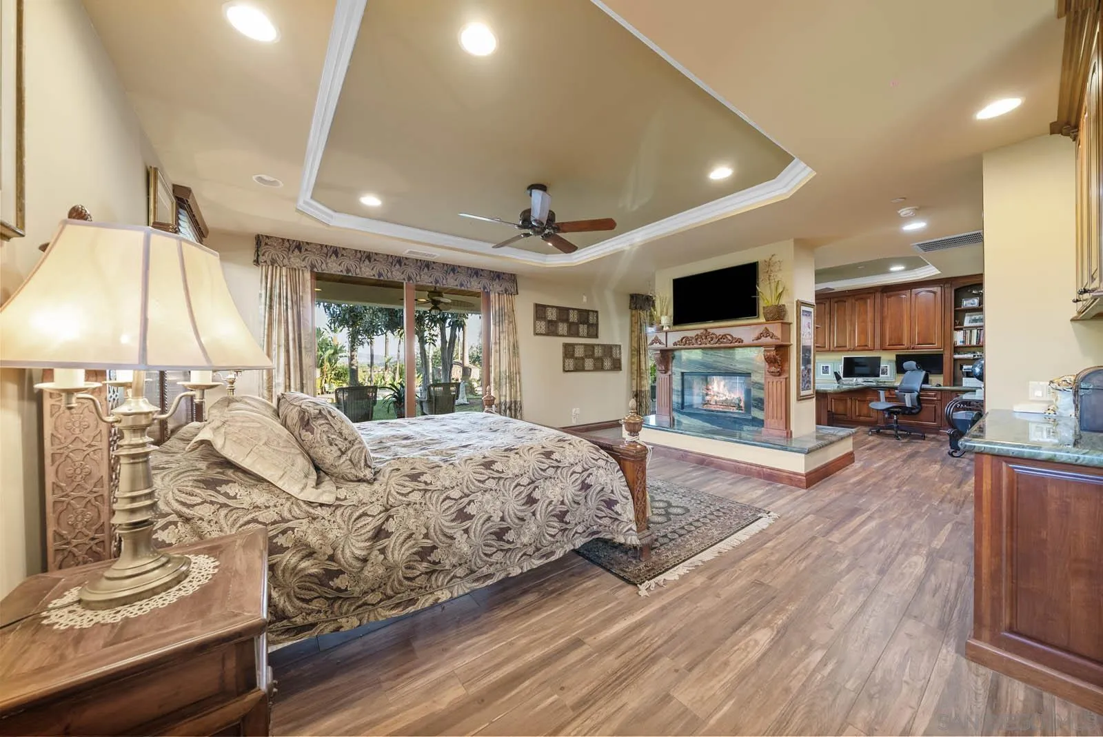 3128 Los Verdes Drive Fallbrook, CA 92028 - Photo 13 of 70 a spacious bedroom with a large bed and a flat tv screen