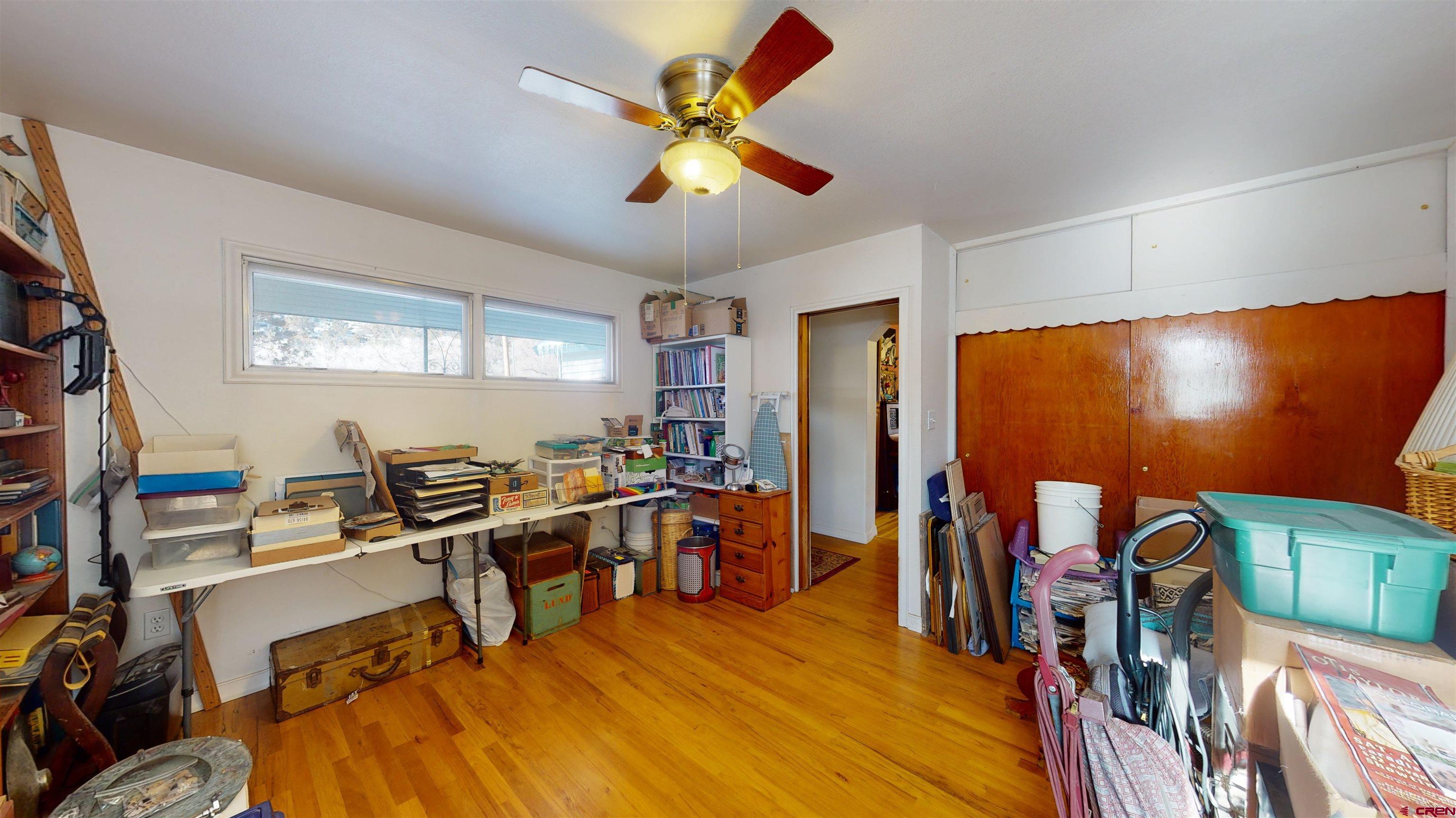 16459 Grange Road Paonia, CO 81428 - Photo 14 of 35 a room with furniture a air conditioner vent and a window