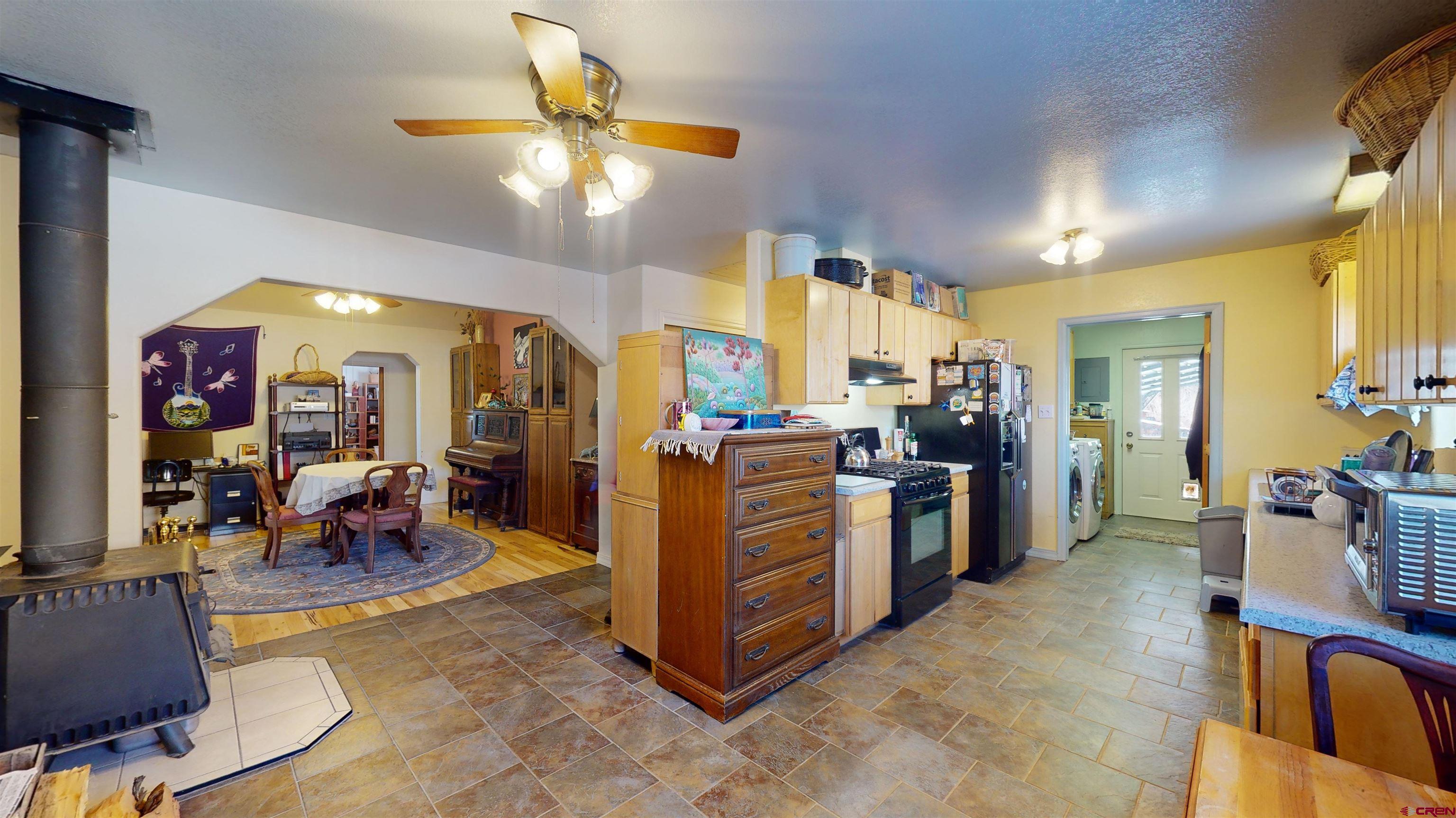 16459 Grange Road Paonia, CO 81428 - Photo 18 of 35 a view of a kitchen with appliances and furniture
