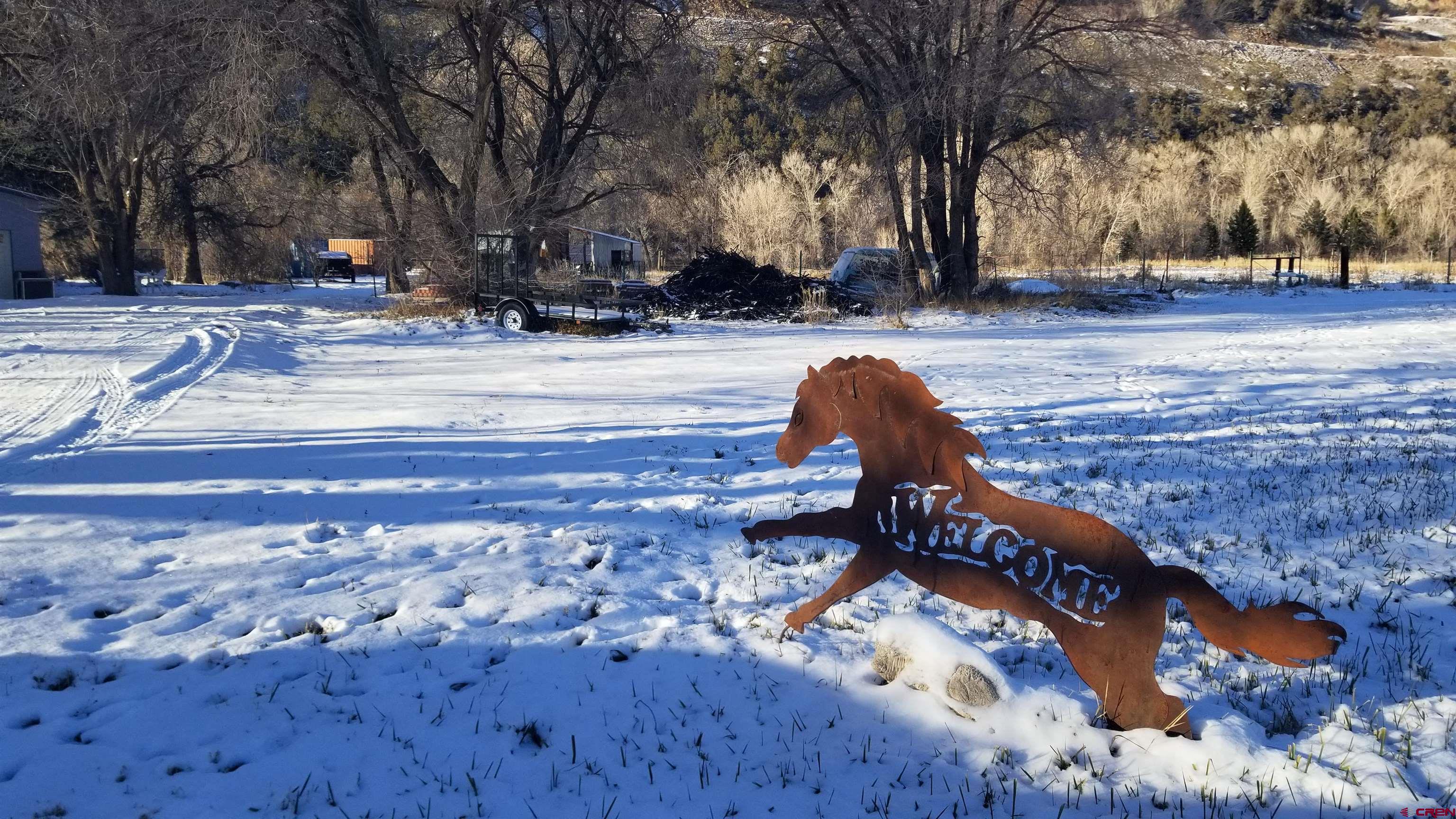16459 Grange Road Paonia, CO 81428 - Photo 2 of 35 a bench sitting in middle of a yard