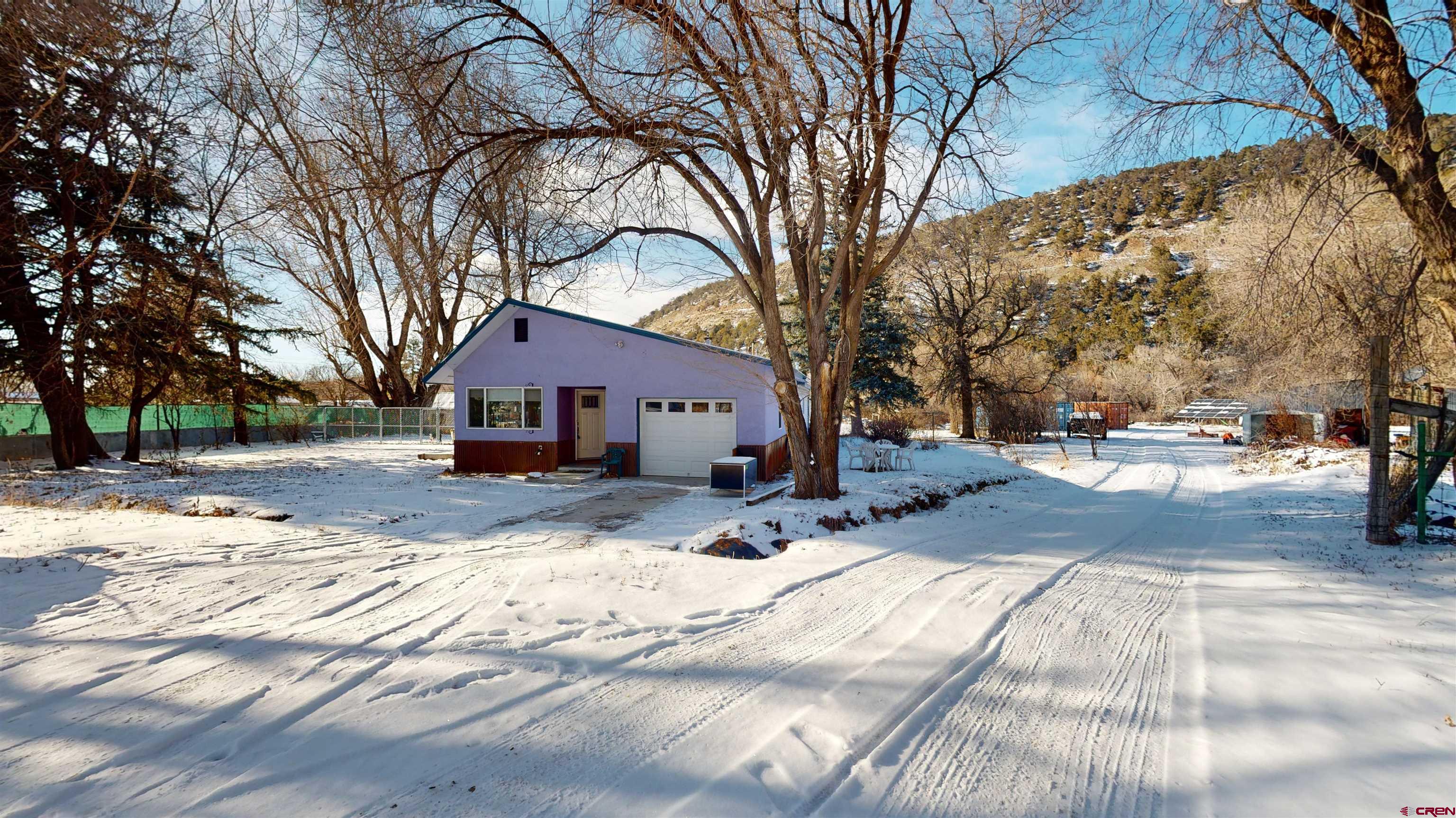 16459 Grange Road Paonia, CO 81428 - Photo 4 of 35 a street view covered with snow