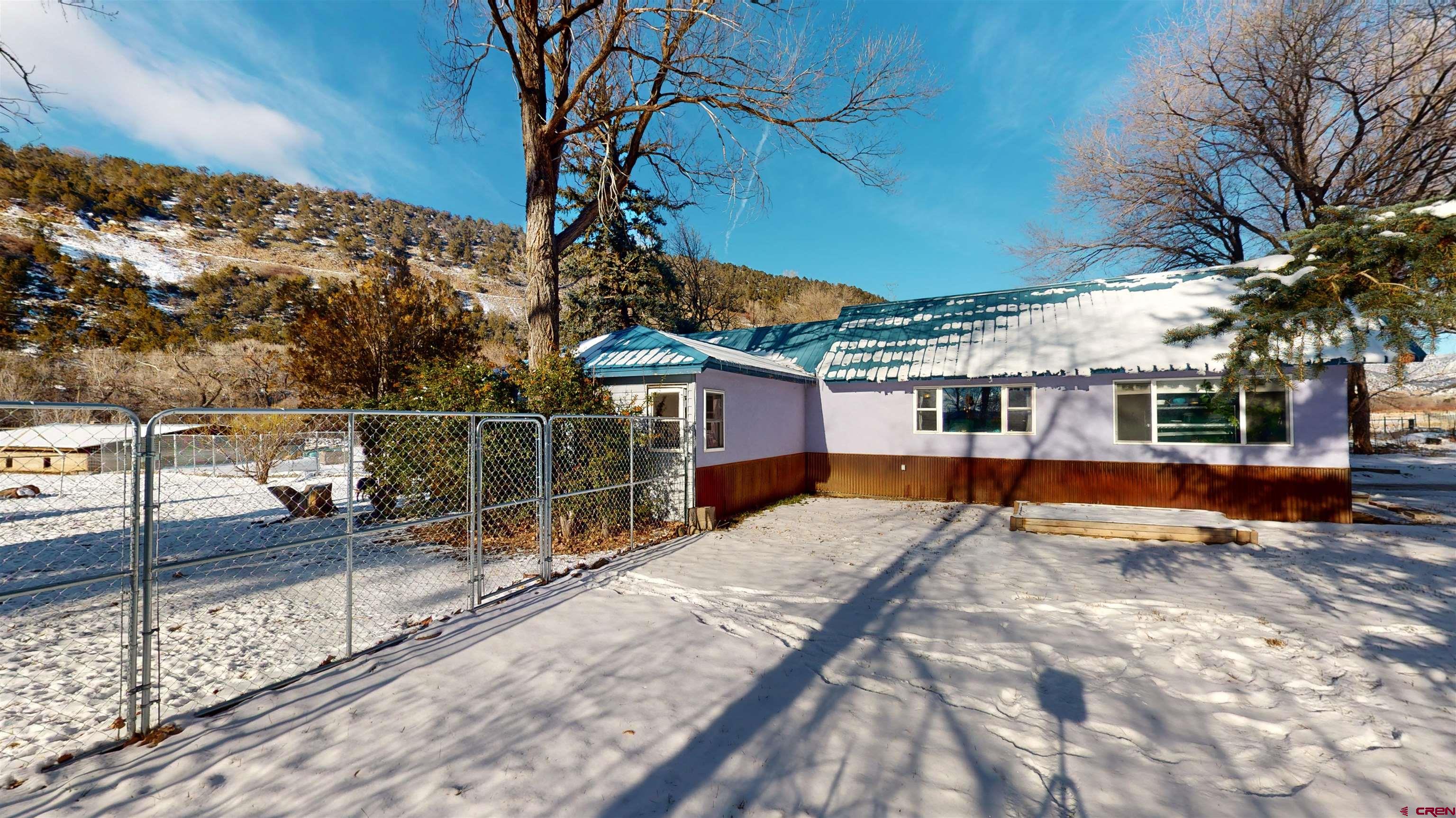 16459 Grange Road Paonia, CO 81428 - Photo 6 of 35 a view of a house with a patio