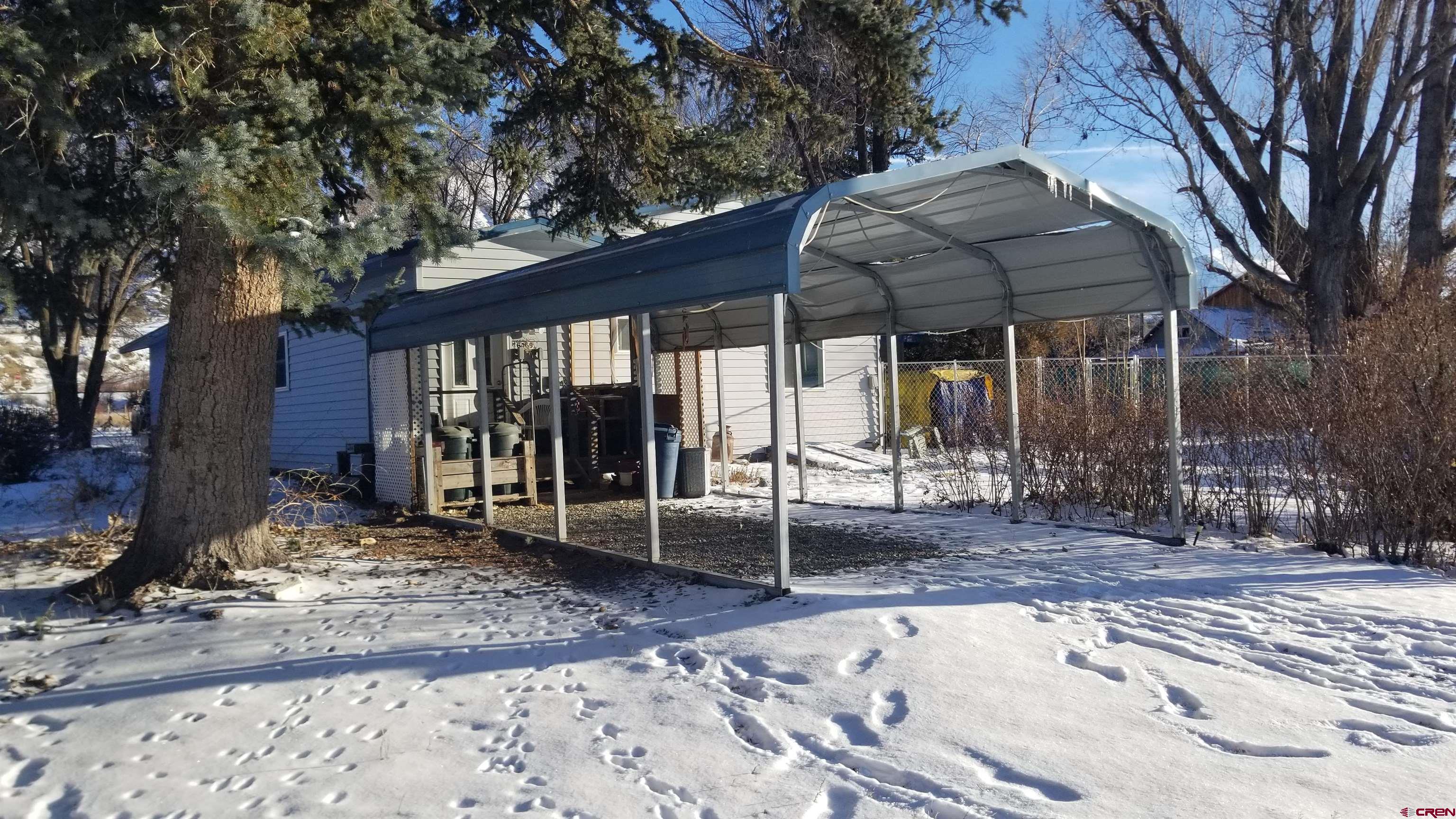 16459 Grange Road Paonia, CO 81428 - Photo 7 of 35 a backyard of a house with tub and trees