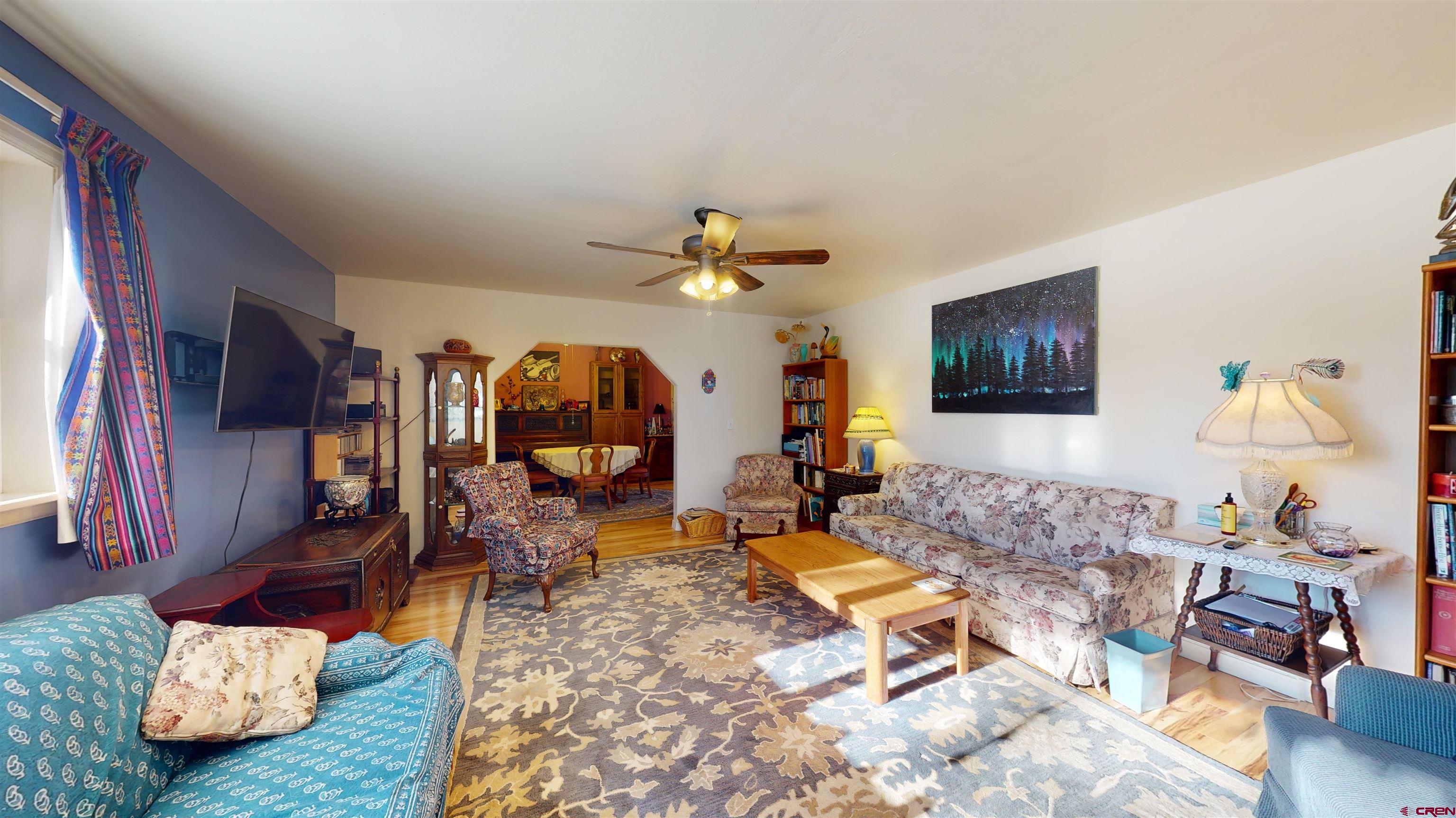 16459 Grange Road Paonia, CO 81428 - Photo 10 of 35 a living room with furniture chess board and a flat screen tv