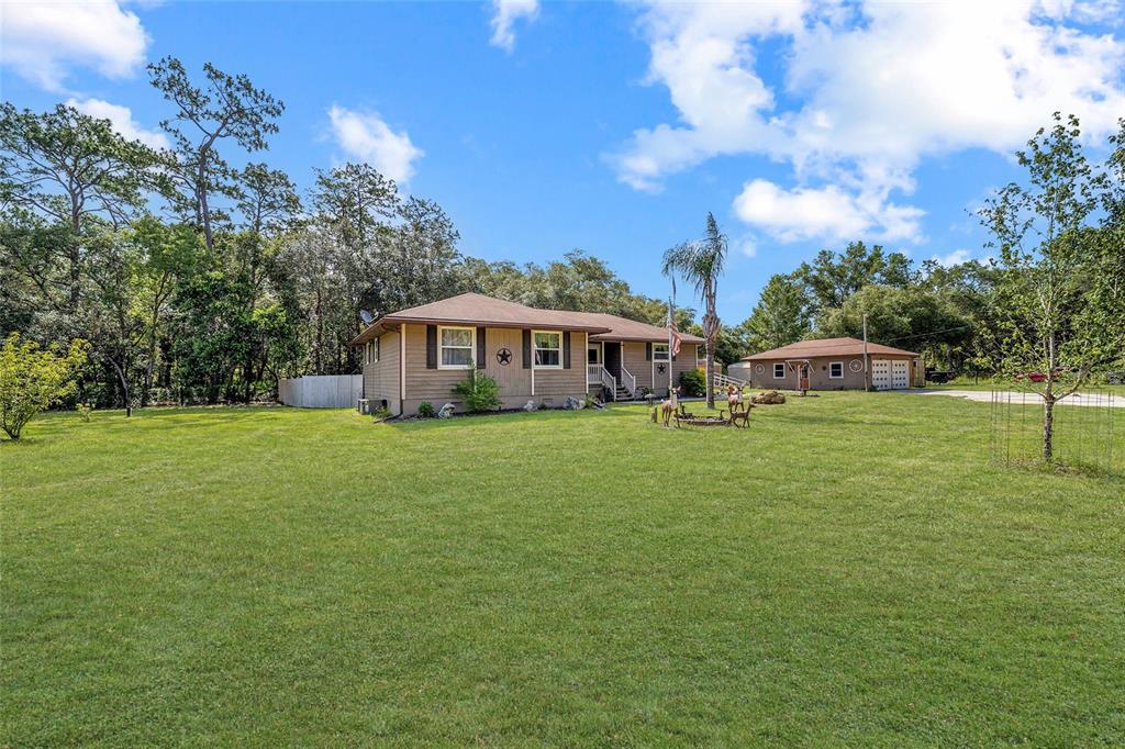 15755 Southwest 90th Avenue Dunnellon, FL 34432 - Photo 1 of 55 a view of house with a big yard
