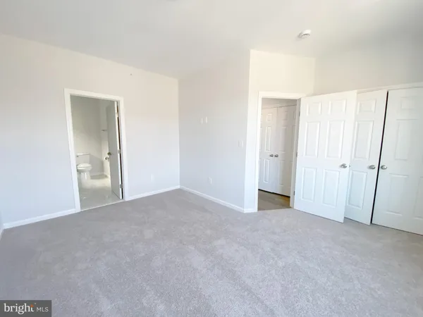 a view of a hallway with stairs