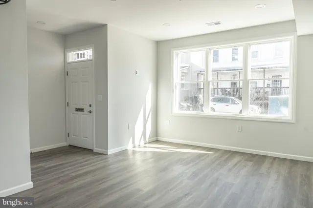 a kitchen with a stove a sink and a refrigerator