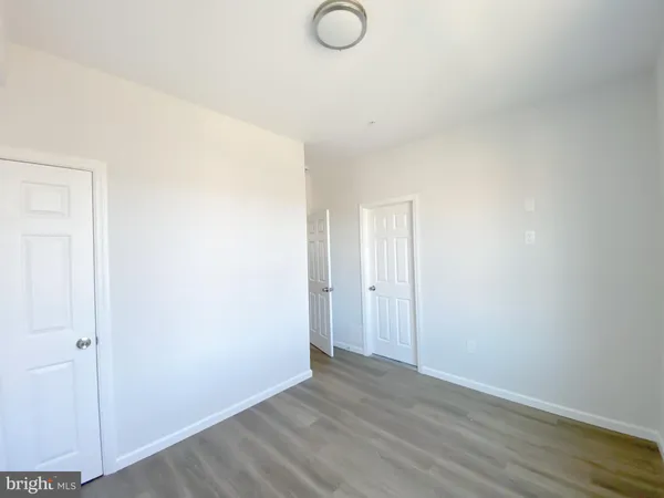 a view of a kitchen with wooden floor
