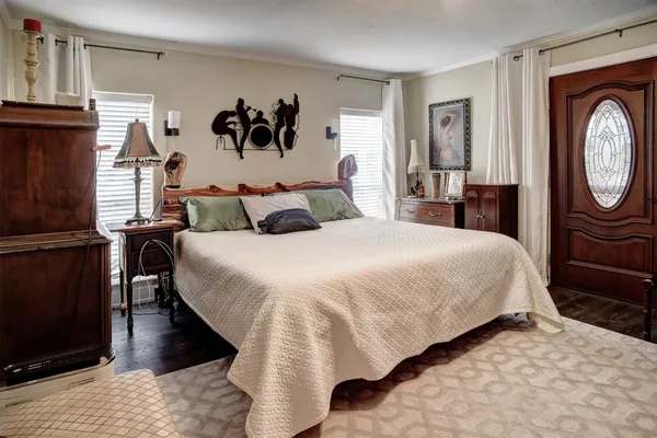 a bed room with a bed and a painting