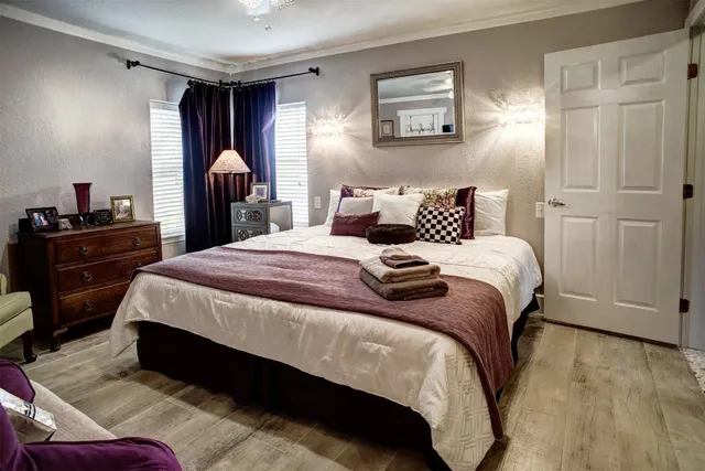 a bedroom with a bed and a dresser