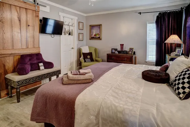 a bedroom with two beds and a closet