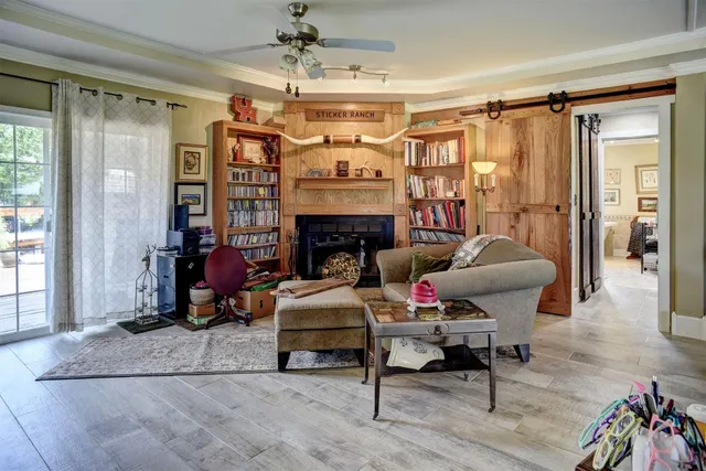 a living room with furniture and a fireplace