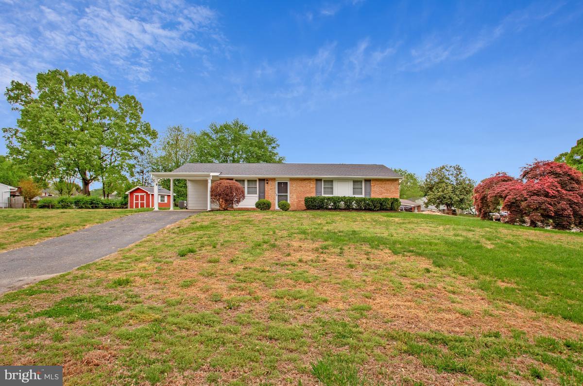 1420 Knight Avenue Dunkirk, MD 20754 - Photo 1 of 30 a front view of a house with garden
