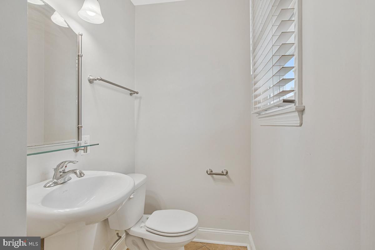 1420 Knight Avenue Dunkirk, MD 20754 - Photo 16 of 30 a bathroom with a sink toilet and mirror