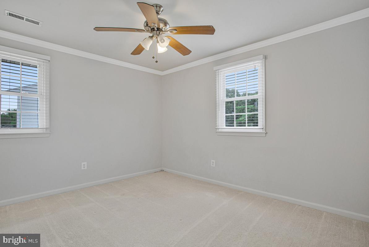 1420 Knight Avenue Dunkirk, MD 20754 - Photo 19 of 30 an empty room with a window and a fan