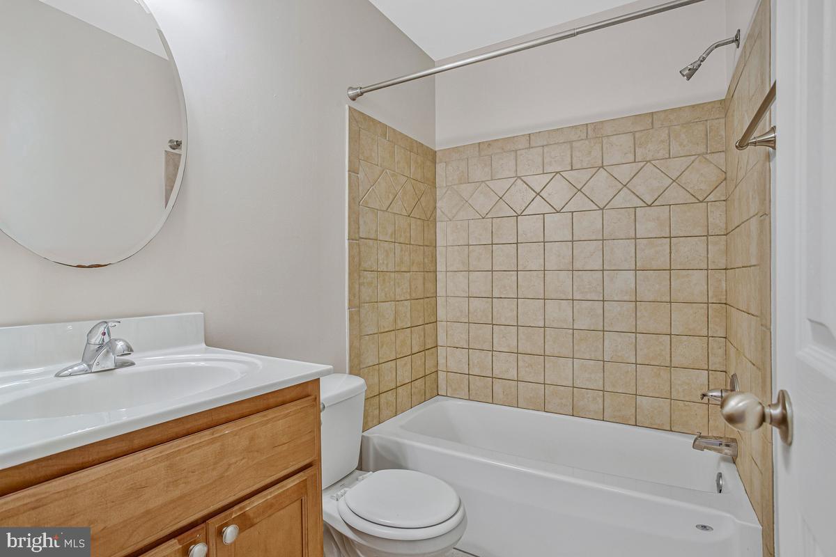 1420 Knight Avenue Dunkirk, MD 20754 - Photo 20 of 30 a bathroom with a bathtub shower sink vanity and toilet