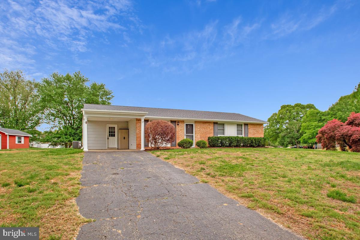 1420 Knight Avenue Dunkirk, MD 20754 - Photo 24 of 30 a front view of a house with a yard and trees