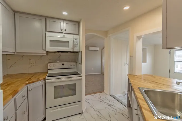 a kitchen with a sink and refrigerator