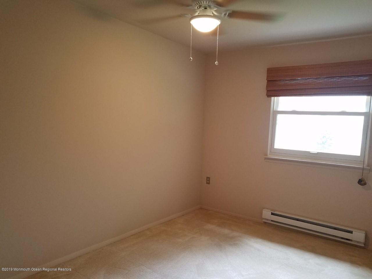 64 A Sunset Road Whiting, NJ 08759 - Photo 10 of 18 a view of a room with gym equipment