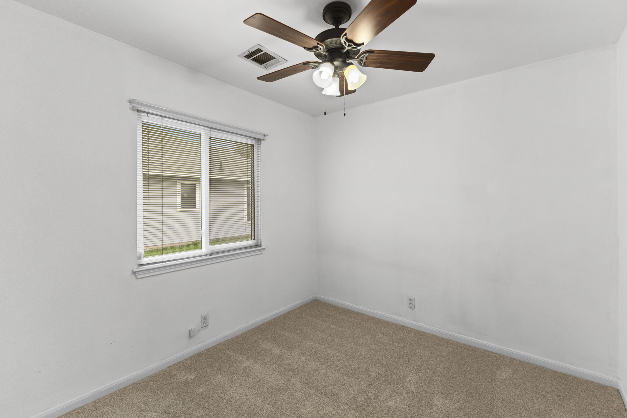 290 Bailey Loop Kyle, TX 78640 - Photo 25 of 33 Carpeted room featuring a ceiling fan with integrated lighting, white walls, and a window with blinds