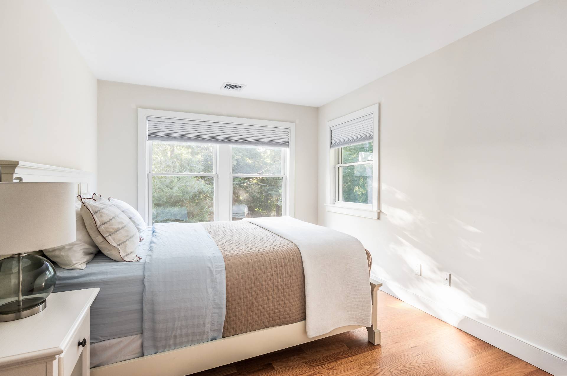 27 Kings Point Road East Hampton, NY 11937 - Photo 11 of 17 a bed sitting in a bedroom next to a window